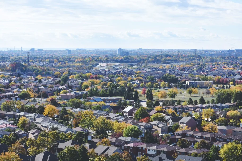 Autumn view over Mississauga suburban neighbourhoods with the city skyline in the distance