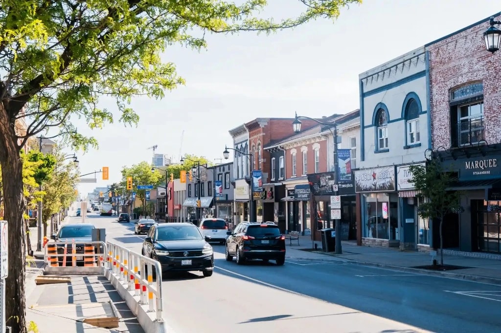 Downtown Milton main street with shops and Downtown Milton banner, Ontario