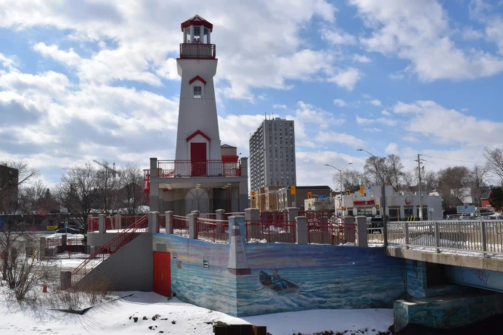 Port Credit lighthouse with mural at the base in Mississauga, Ontario