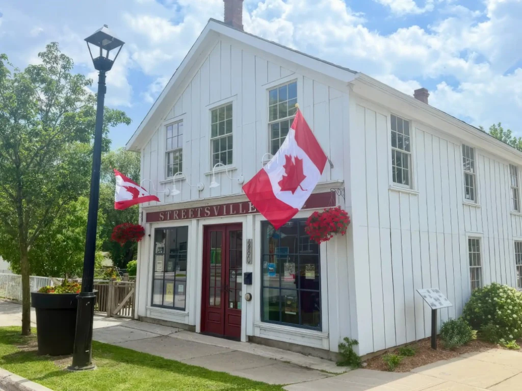 Streetsville village hall with Canadian flags in Mississauga, Ontario